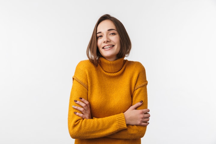 Woman smiling after orthodontic treatment